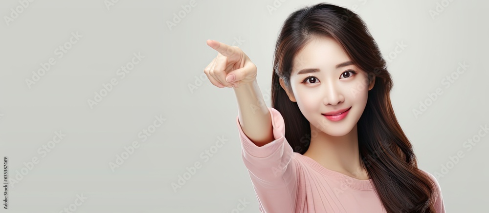Asian woman posing with copy space and happy expression ideal for advertising isolated on white Asian woman posing with copy space and happy expression ideal for advertising isolated on white
