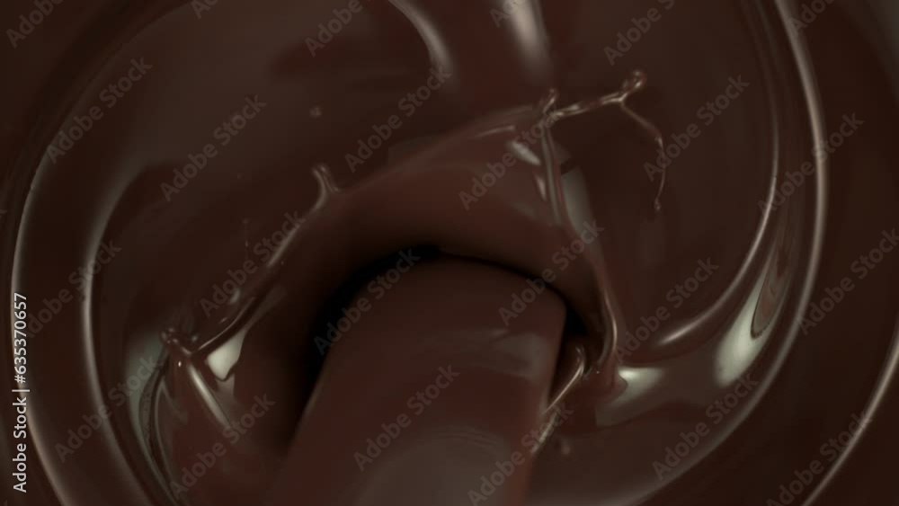 Super Slow Motion Shot of Pouring and Splashing Melted Chocolate at 1000fps. Super Slow Motion Shot of Pouring and Splashing Melted Chocolate at 1000fps.