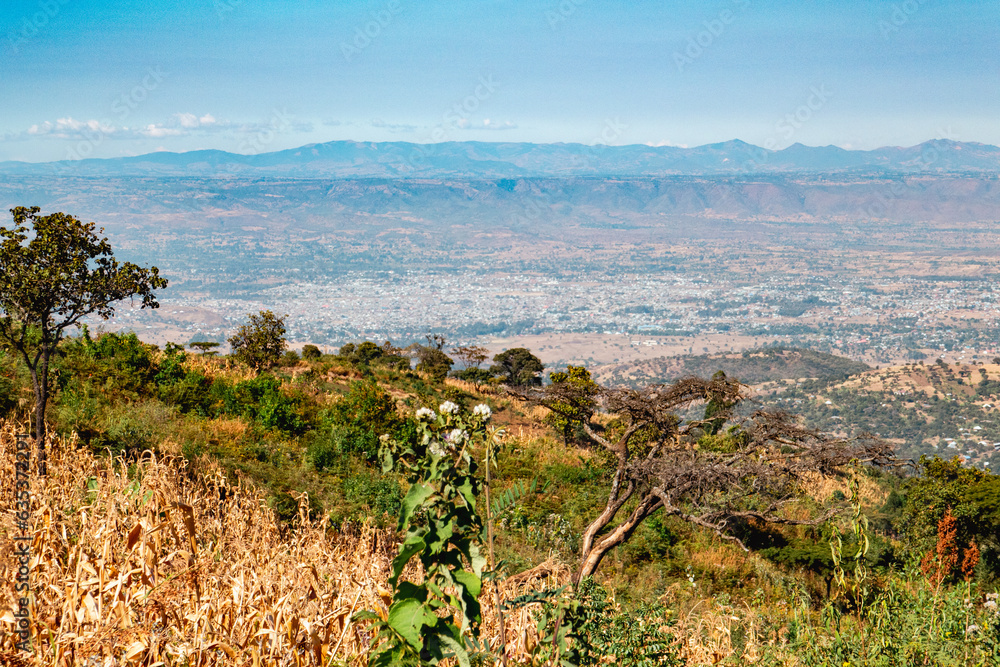 Scenic view of a valley against sky at Mbeya Peak, Tanzania Scenic view of a valley against sky at Mbeya Peak, Tanzania