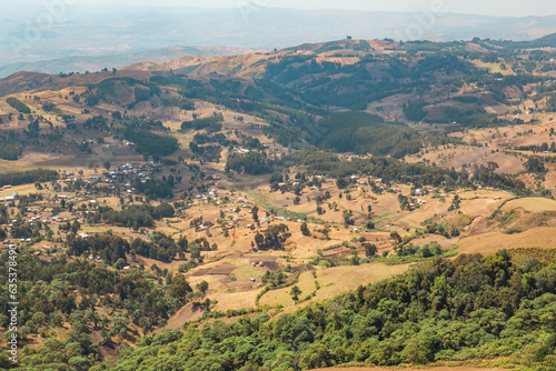 View of a valley against mountains seen from Mbeya Peak, Mbeya Mountain range in Mbeya Region, Tanzania