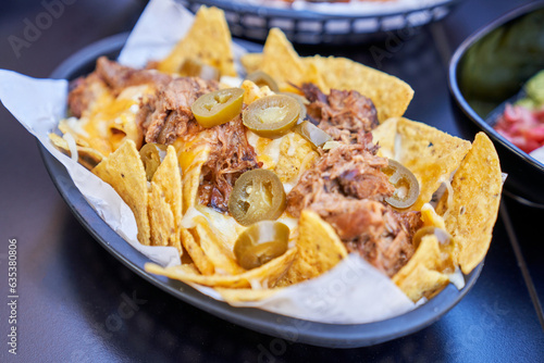 Delicious nachos with chicken and jalapeno