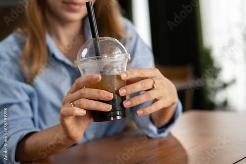 close-up of caucasian young woman drink bubble tea at the restaurant