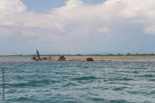 Wallpaper Mural remains of shipwreck on saltmarsh at lagoon, Grado, Italy Torontodigital.ca