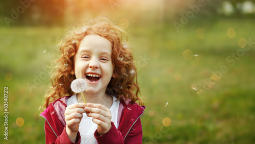 Beautiful curly girl smiles and shows healthy white teeth.