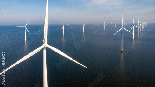 Windmill park in the ocean aerial view with wind turbine Flevoland Netherlands Ijsselmeer. Green Energy production in the Netherlands