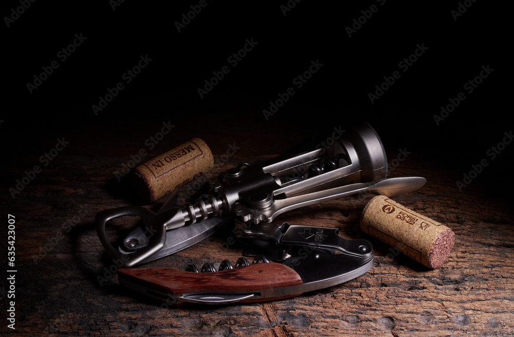 Close up of wine opener tool and wine corks
