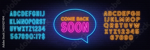 Come Back Soon neon sign in the speech bubble on brick wall background.