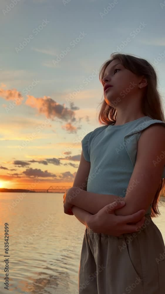 portrait of a little girl at sunset on the beach,. portrait of a little girl at sunset on the beach,.