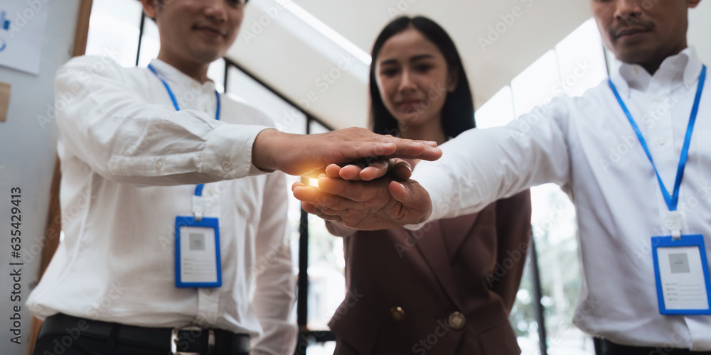 Business people stack touch arms palms together celebrating promotion reward, succeed common aim. Give high five symbol of unity Business people stack touch arms palms together celebrating promotion reward, succeed common aim. Give high five symbol of unity