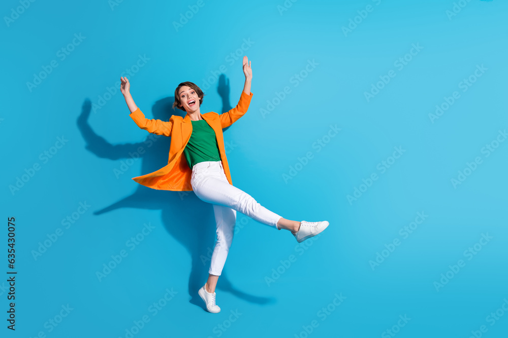 Full size cadre of youngster business investor woman celebrate her startup growing progress dancing isolated on blue color background