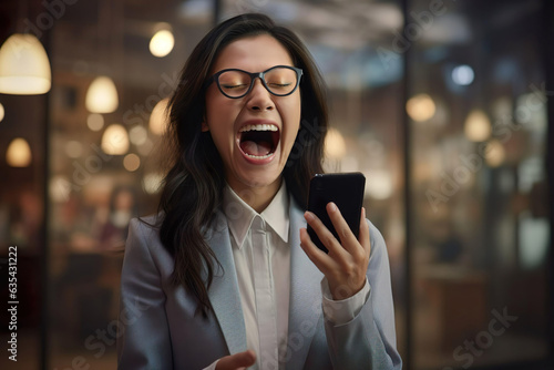 Beautiful asian young woman looking mobile phone laughing with good message at restaurant. Excited customer holding smartphone using mobile app feeling great positive surprise reaction.