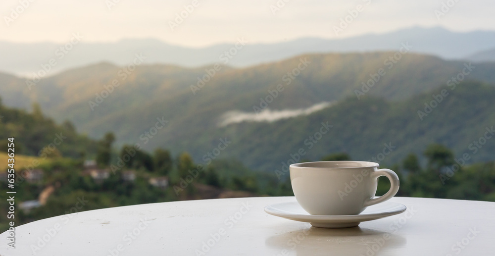 Cup of coffee on table, nature view in morning, Chiang Mai, Thailand