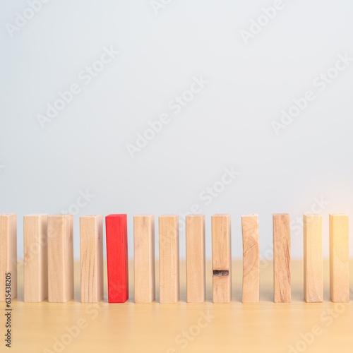 Red domino wooden block on table. Business planning, Risk Management, Solution, leader, strategy, different, Hiring, Human Resource and Unique Concepts