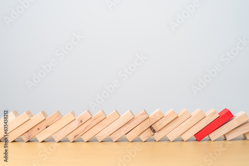 wood domino blocks falling on table. Crisis  fall Business  Risk management  Economic recession  Strategy and solutions concept