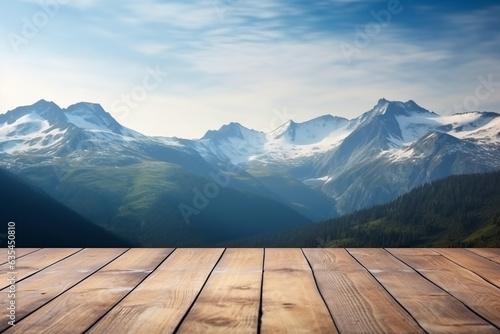 Good web concept for advertisement or banner with beautiful mountain landscape in background and wooden deck in front with copy space.
