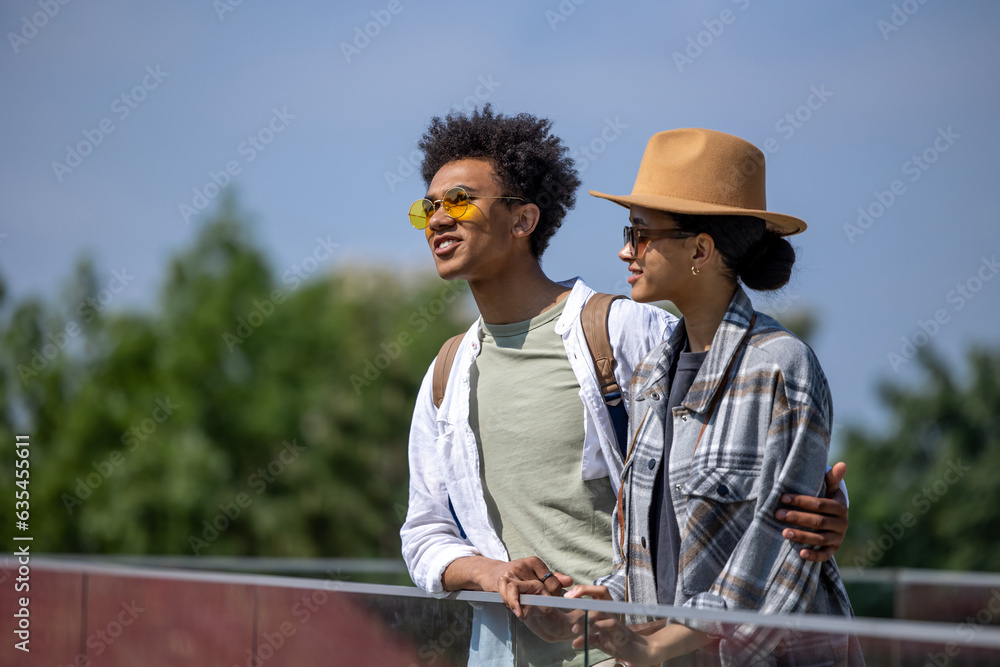 Young couple having a walk and looking happy Young couple having a walk and looking happy