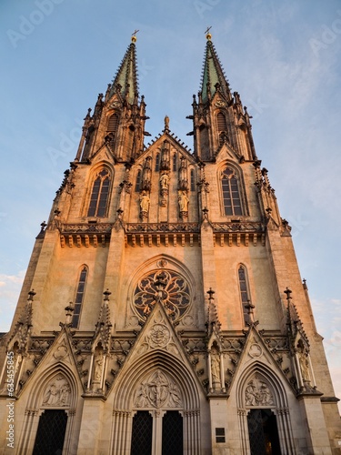 The facade of the Neo-Gothic Cathedral of St. Wenceslas in Olomouc. It is decorated with sculptures and a large circular window representing a mystical rose