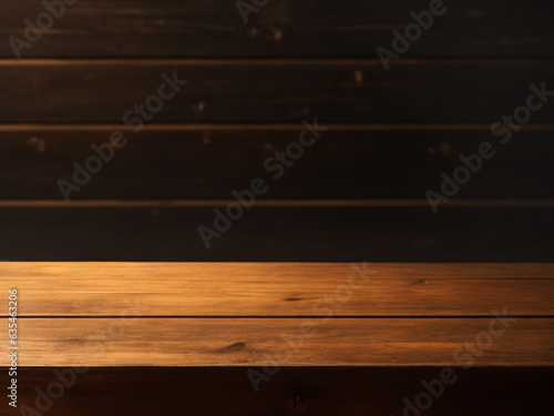 Empty brown wooden table with blurry wall in dark room background. Ready for product presentation display copy space for your text.