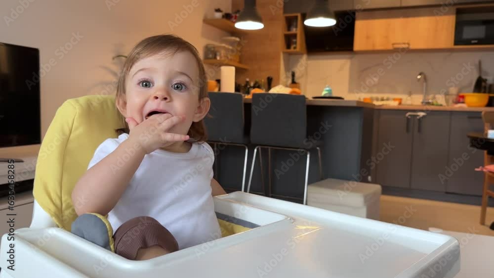 Adorable child in the highchair Adorable child in the highchair