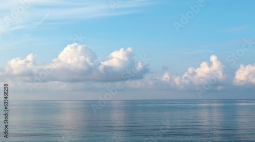 calm sea with blue sky and white clouds