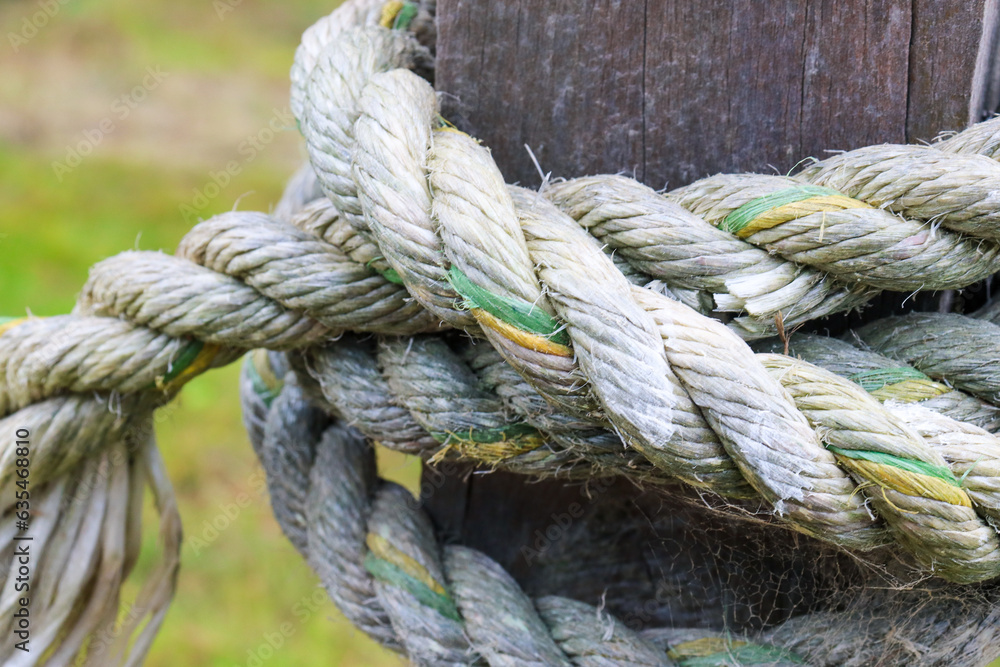 close up of a rope knot on post close up of a rope knot on post