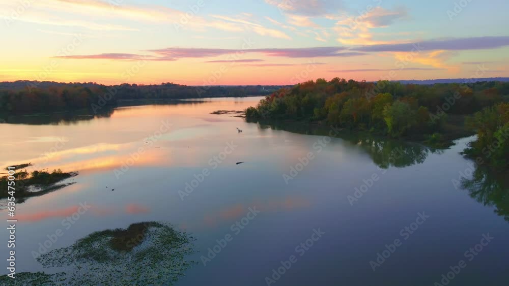 Beautiful still lake in the mountains of Arkansas with mirrored water reflection shot vial drone aerial in colorful fall Beautiful still lake in the mountains of Arkansas with mirrored water reflection shot vial drone aerial in colorful fall