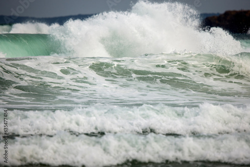 Abstract landscape with sea waves at the shore on a windy day.