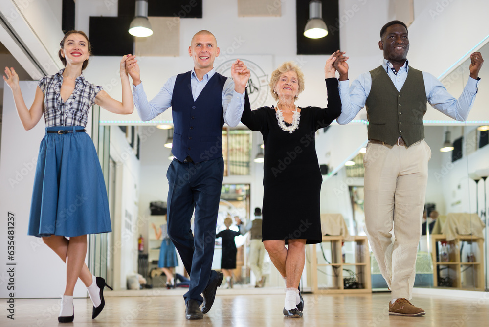 Fototapeta premium Group of different age dancers preparing swing performance