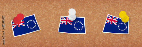 Cook Islands flag pinned in cork board, three versions of Cook Islands flag.