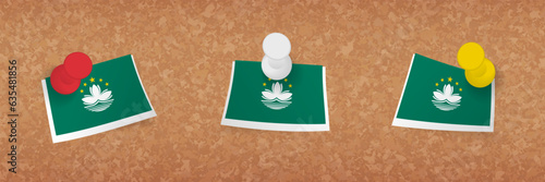 Macau flag pinned in cork board, three versions of Macau flag.