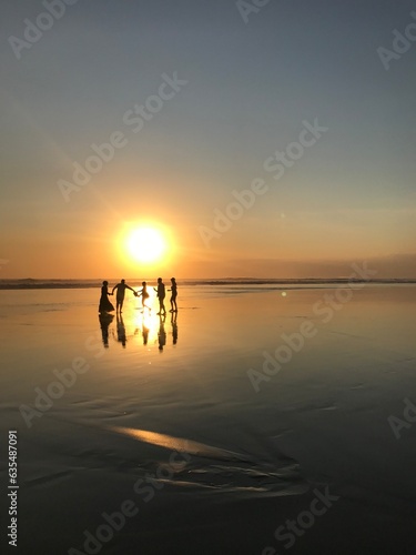 Happy family on the beach © Kayleigh