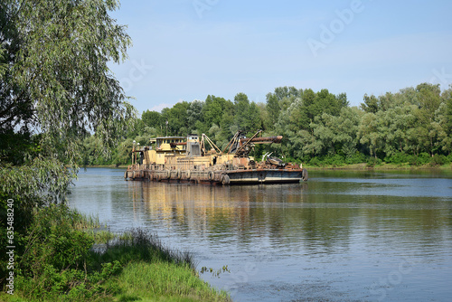 Extraction of sand by a dredge in the river. photo