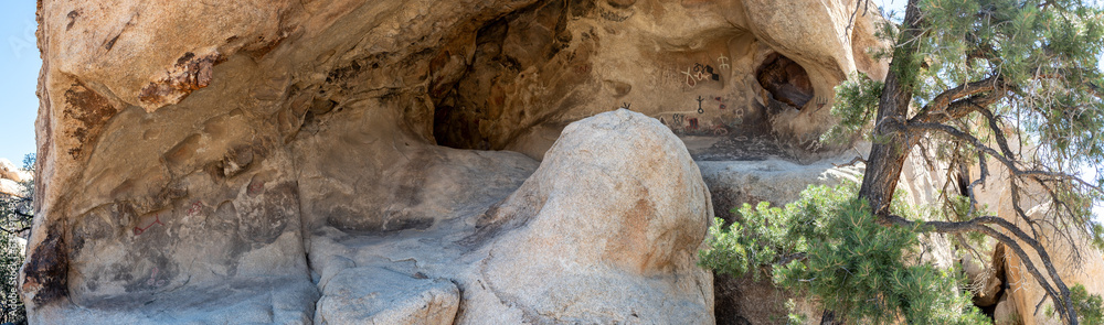  Ancient native American petroglyphs under a cave Joshua Tree National Park