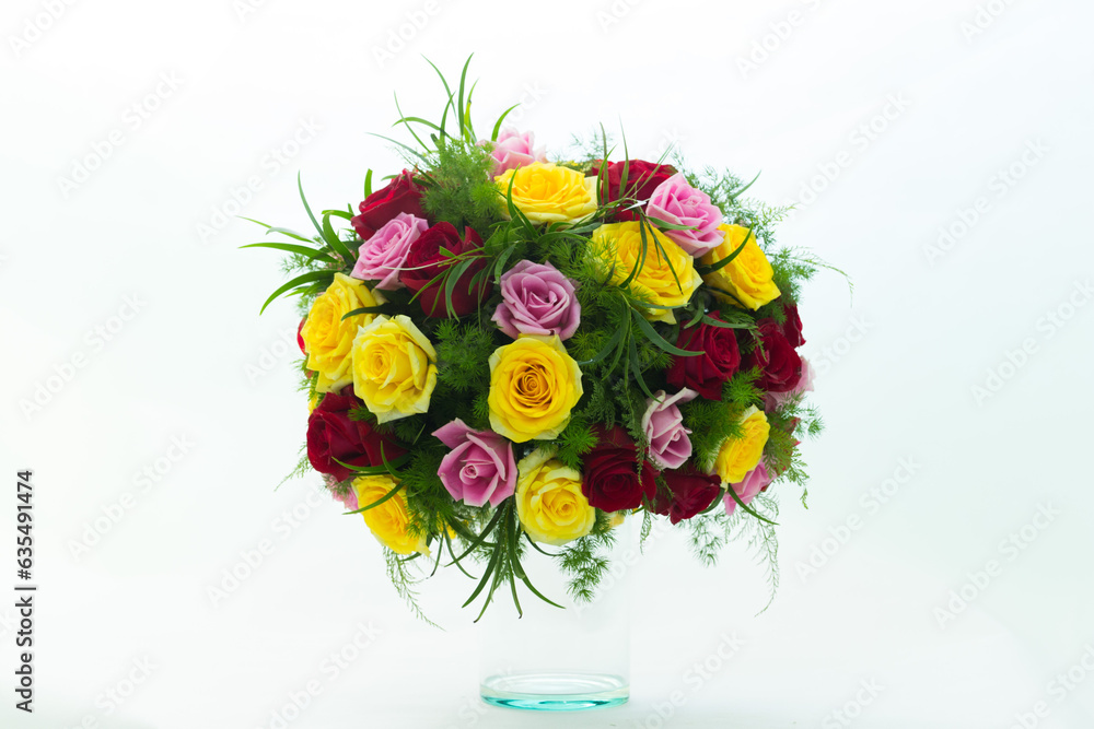 Many kinds of beautiful flowers put in vase on a white background