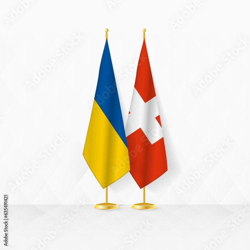Ukraine and Switzerland flags on flag stand, illustration for diplomacy and other meeting between Ukraine and Switzerland.