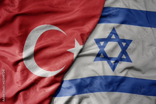 Fototapeta big waving national colorful flag of turkey and national flag of israel