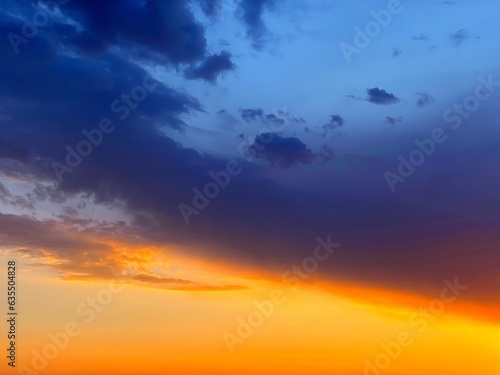 Dramatic Sunset sky clouds  orange blue dusk in heaven.