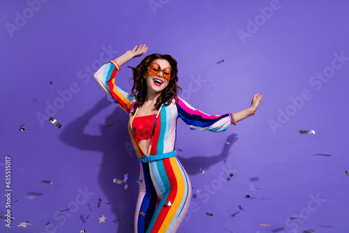 Photo of pretty sweet girl dressed striped overall dark eyewear having disco fun isolated violet color background