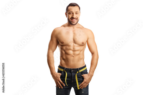 Topless man wearing jeans with a measuring tape around waist