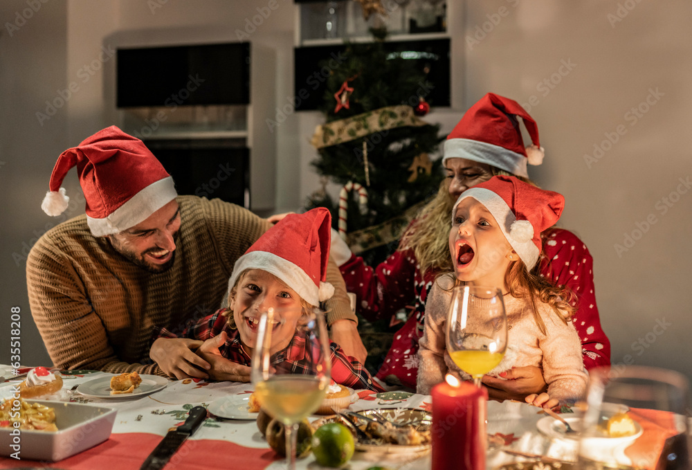 happy family celebrating christmas having dinner, singing together happy family celebrating christmas having dinner, singing together