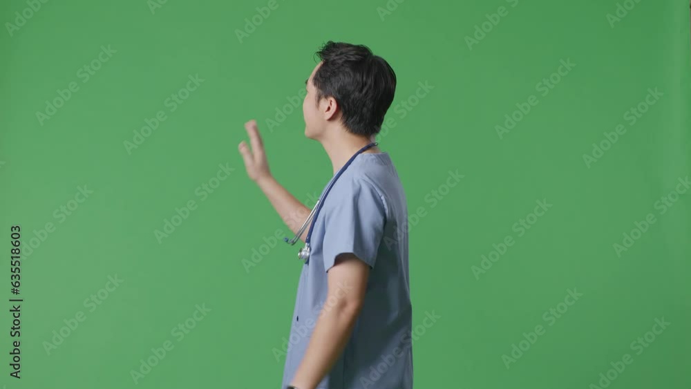 Side View Of Asian Male Doctor With Stethoscope Waving Hand And Smiling While Walking On Green Screen Background In The Hospital
Side View Of Asian Male Doctor With Stethoscope Waving Hand And Smiling While Walking On Green Screen Background In The Hospital