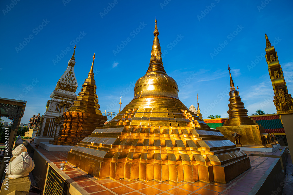 Fototapeta premium Pagoda gold and church in wat thai reflect with sun sky in day time in Bangkok Thailand.