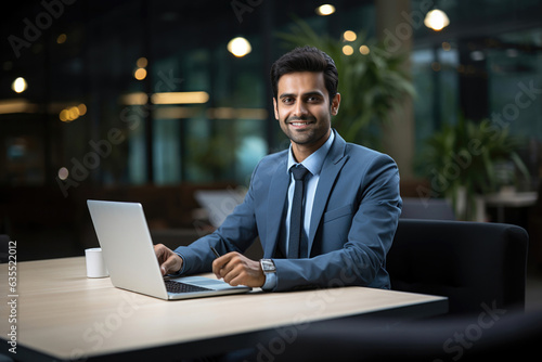 Indian handsome businessman working in the corporate office © StockImageFactory