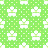 White stylized flowers on geen dotted background vector seamless pattern. Best for textile, wallpapers, home decoration, wrapping paper, package and web design.