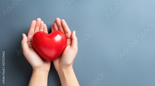 hand holding red heart  love passing