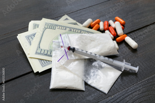 Money, drugs and syringe on...