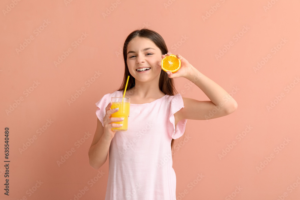 Little girl with glass of juice and orange on pink background Little girl with glass of juice and orange on pink background