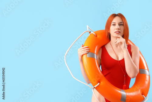 Female lifeguard with ring ...