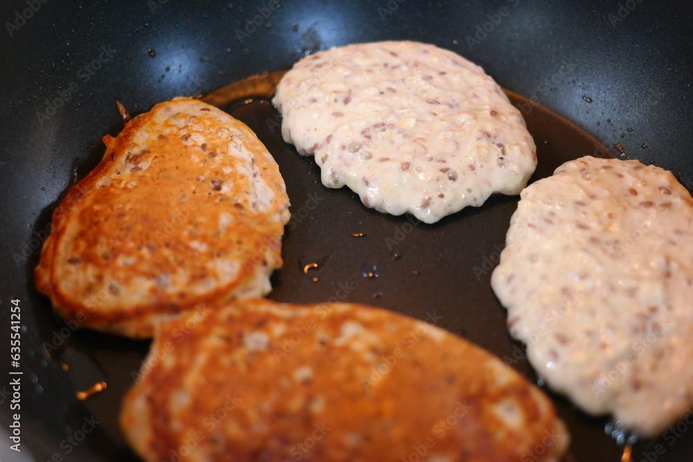 pancakes in a pan. Frying Pan On The Stove. Pancake Burned On The Pan. Mans Hand Turns The Pancake To The Other Side. He Lingers When He Sees That The Pancake Has Burned. pancakes in a pan. Frying Pan On The Stove. Pancake Burned On The Pan. Mans Hand Turns The Pancake To The Other Side. He Lingers When He Sees That The Pancake Has Burned.