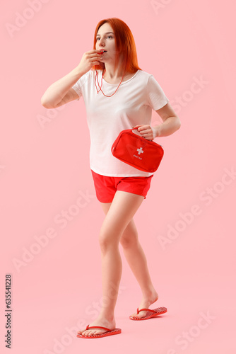 Female lifeguard with first...